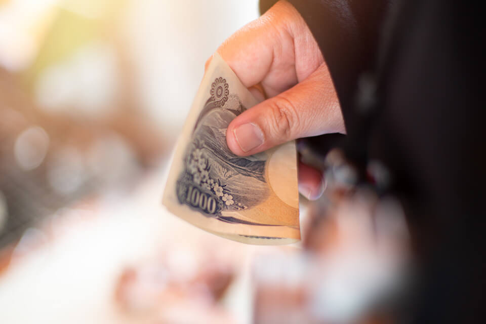 手_お金_1000円